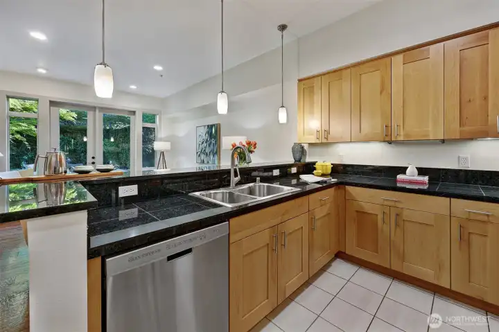 In-kitchen eating area, tile floor, stainless steel appliances and granite counter tops.