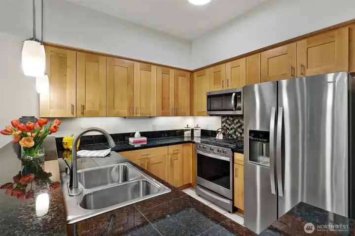 The "U" shape kitchen allows more counter space and look at all that storage.