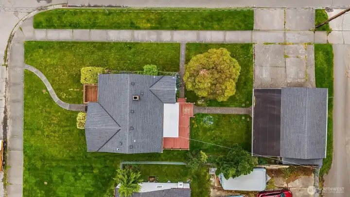 Top down view of spacious corner lot, detatched garage & alley access.