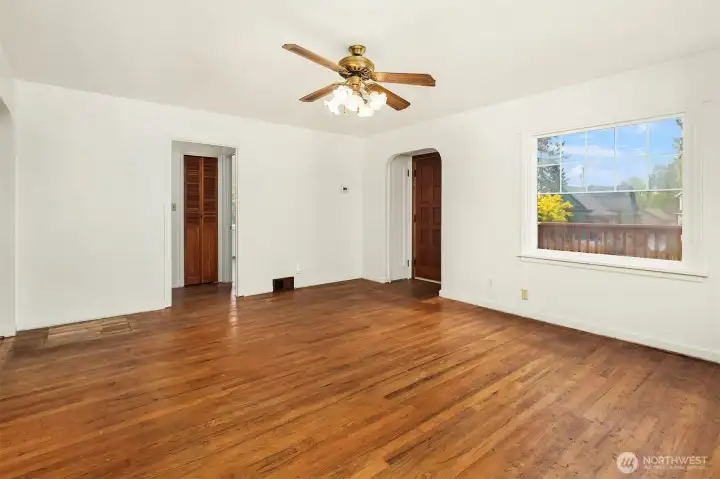 Living room with large windows providing ample natural light.