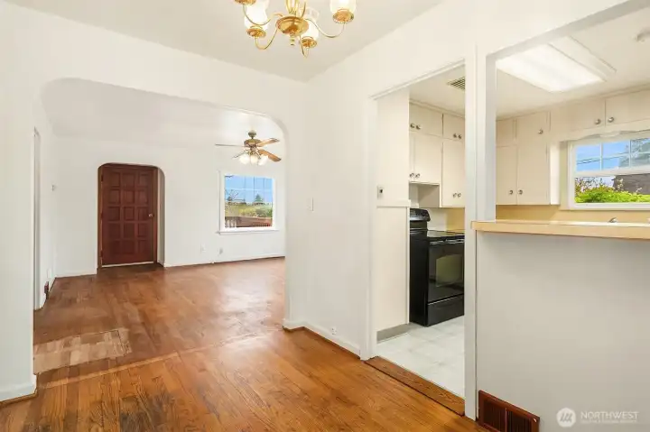 Seamless flow between living room, dining room and kitchen.