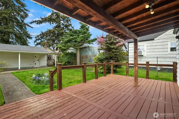 Back porch with access to detached garage.
