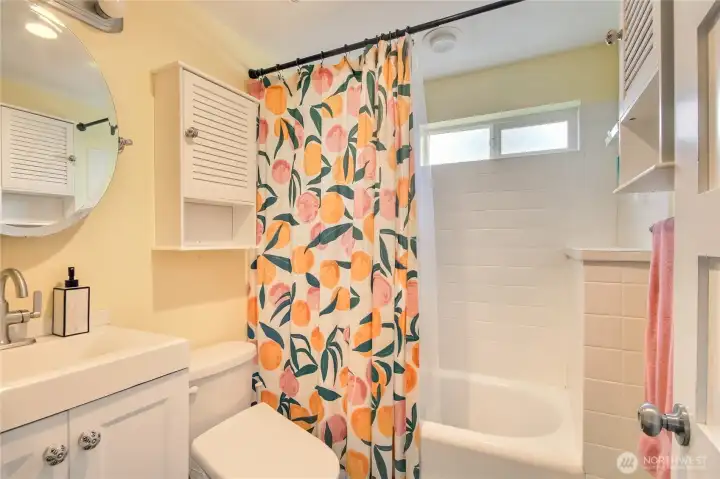 Updated full bathroom with built-in shelf. Updated full bathroom with built-in shelf.
