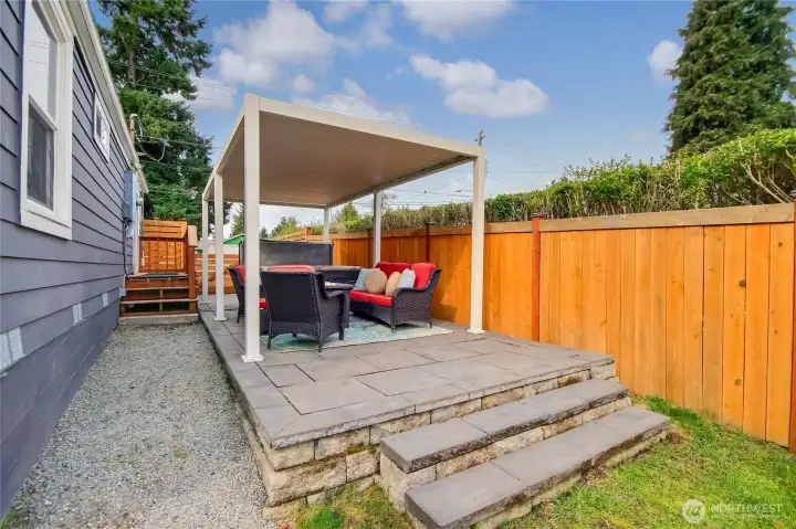 Stylish paver patio topped with a custom pergola. Stylish paver patio topped with a custom pergola.