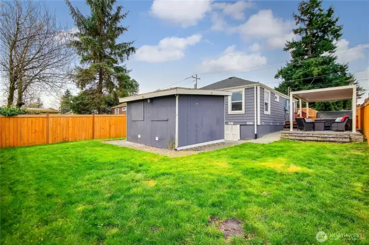 Fully fenced backyard with room to garden and play. Fully fenced backyard with room to garden and play.