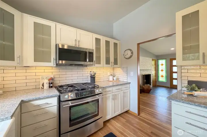 Kitchen updated with quartz counters, painted cabinetry and newer appliances. Kitchen updated with quartz counters, painted cabinetry and newer appliances.