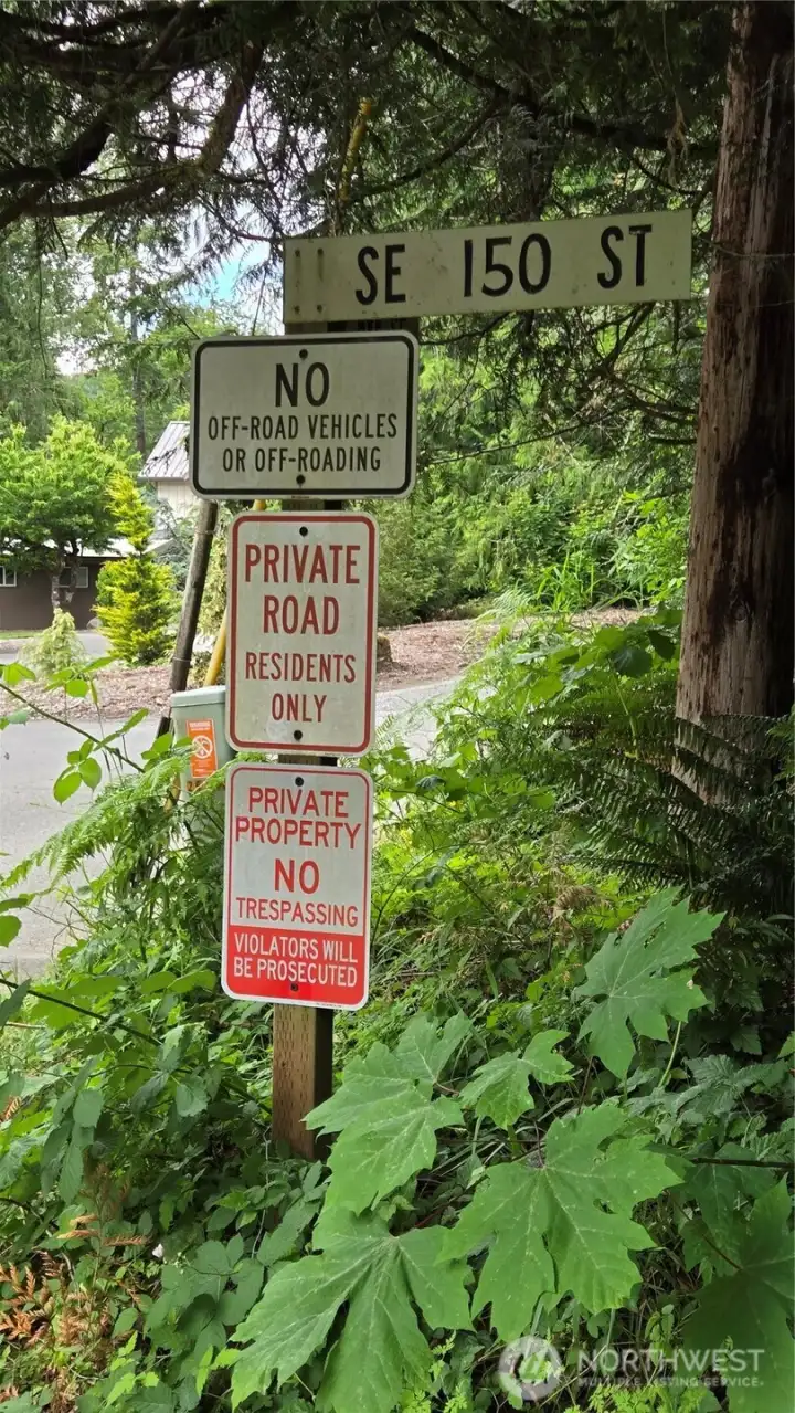 Turn RIGHT at this sign and follow SE 150 ST to the top of the hill and look Real Estate Arrow showing you where to park and walk in. Turn RIGHT at this sign and follow SE 150 ST to the top of the hill and look Real Estate Arrow showing you where to park and walk in.