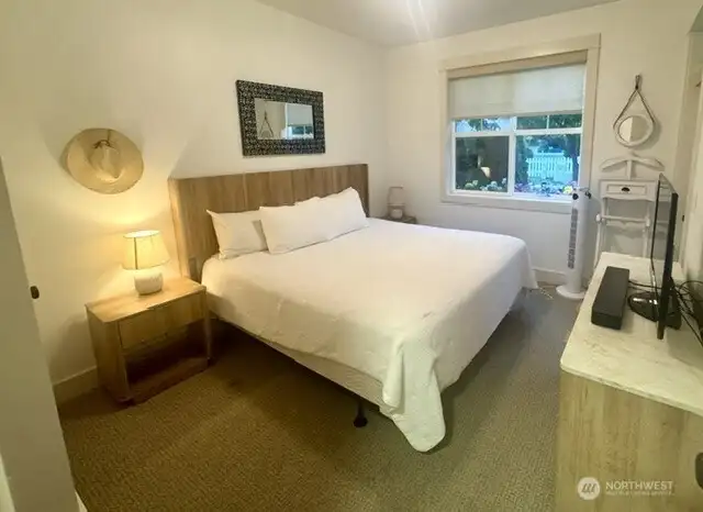 Primary Suite has a modern cottage flair, and offers new King bed, dresser, and more.
