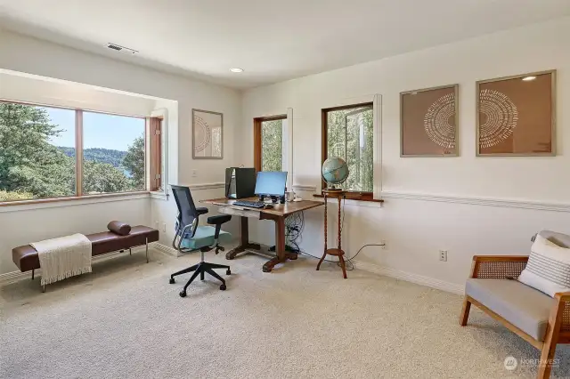 Third bedroom overlooking rear gardens with Lake Washington views, east and south facing windows, bumped out and lined w/ newer douglas fir opening double pane windows.
