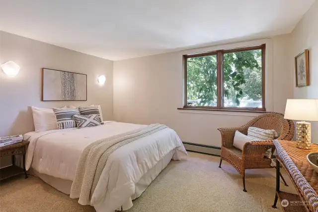 4th bedroom on lower level overlooking lush rear gardens and Koi Pond, carpeted and freshly painted Benjamin Moore White Dove.