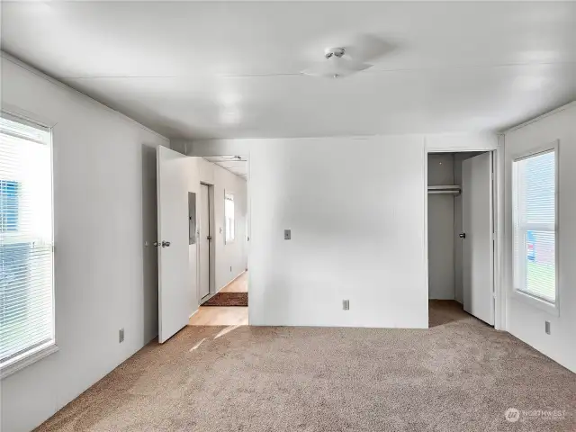 The spacious primary bedroom is a true retreat, featuring an attached bath for convenience and a walk-in closet offering ample storage space. This private and functional suite is perfect for unwinding at the end of the day.