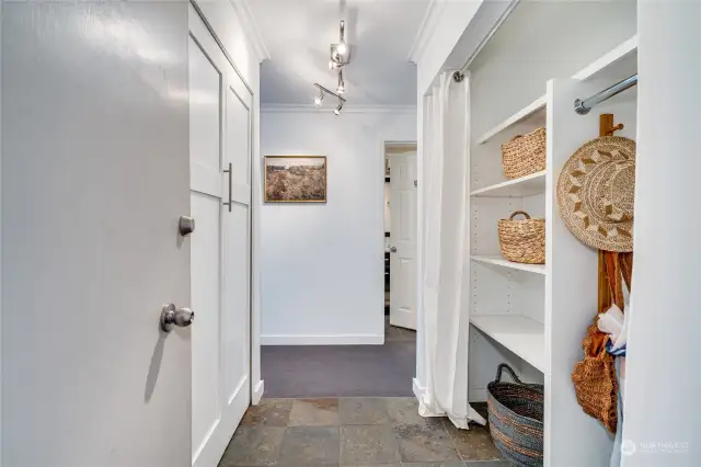 The entryway features large custom California Closets on each side. There is also a dedicated storage unit down the hall in the laundry room.