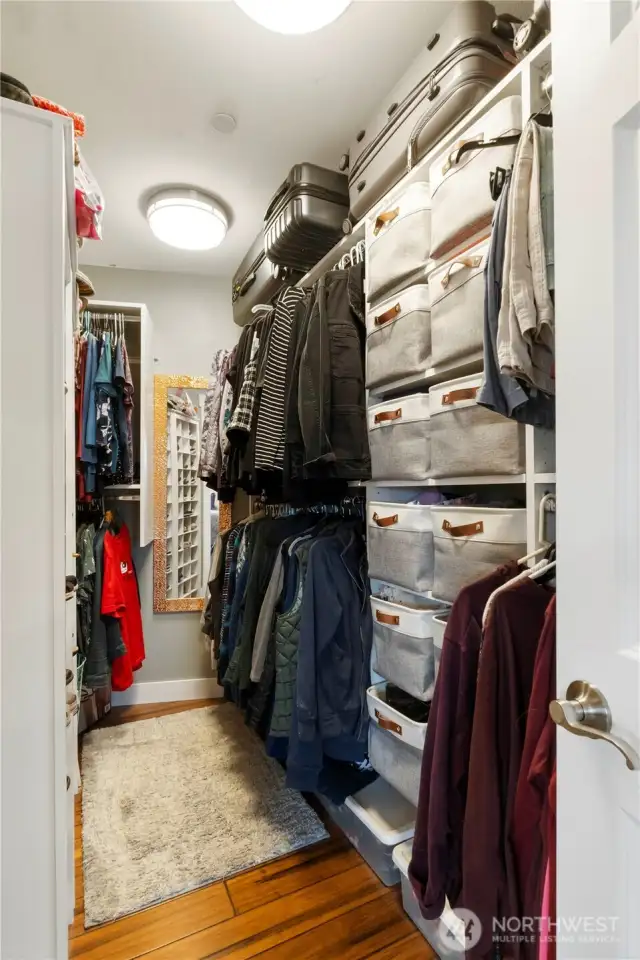 Primary bedroom walk in closet