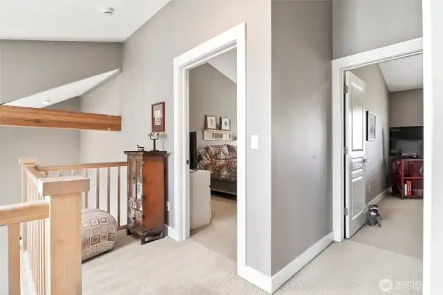 hall facing primary and second bedroom