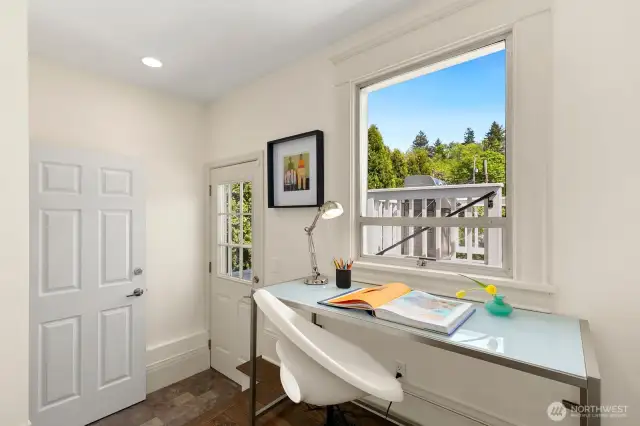 Quiet overlook to deck and backyard.  A kitchen/office for quick organizing.