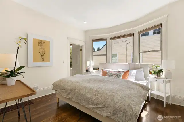 Main floor primary with hardwoods, adjoins to dressing room and full bath.