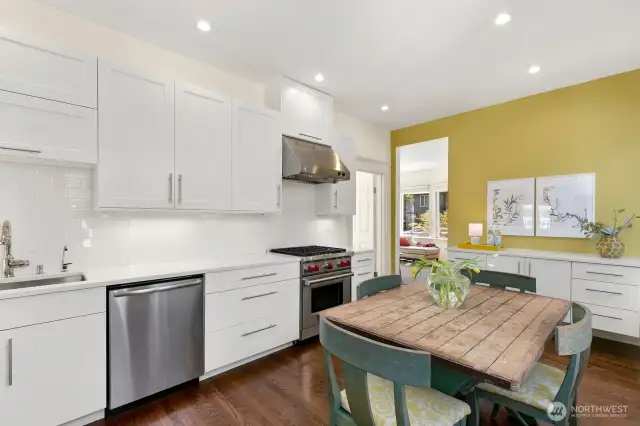 Wolf gas range, Mongram Vent Hood, Bosch Dishwasher and KitchenAid Refrigerator.  Custom buffet is wire with electricity! Pental Quarts countertops throughout.