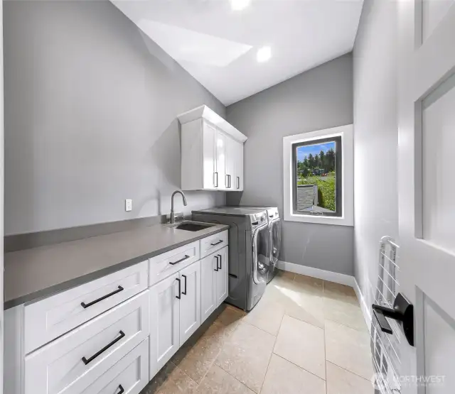 Laundry room with plenty of folding space and storage