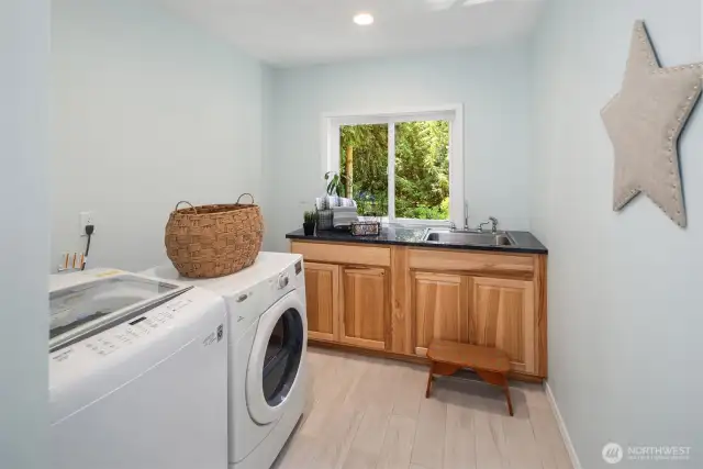 This wonderful dedicated laundry room has been added to the original floorplan.