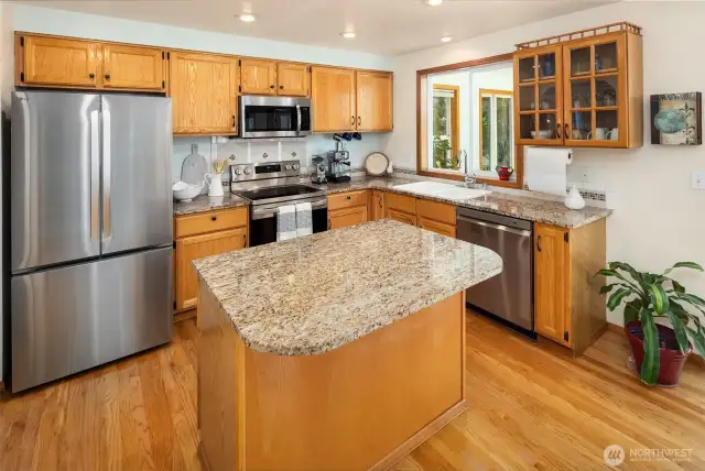 Cabinetry offers pull-outs and cutlery tray.