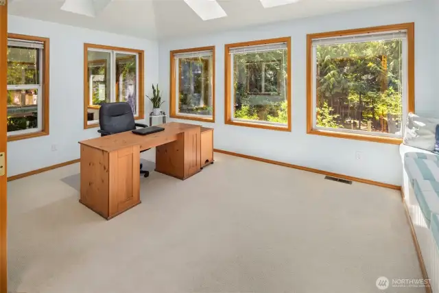 This fabulous flex room perfect for home office, playroom, sunroom....you decide!  Built-in seating offers extra storage.