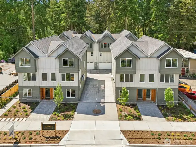 4 street side units are 2 bedroom, 2.5 bath, 1318 square with 2 car EV garages. 4 rear units are 4 bedroom, 2.5 bath, 1830 square feet with 2 car EV ready garages
