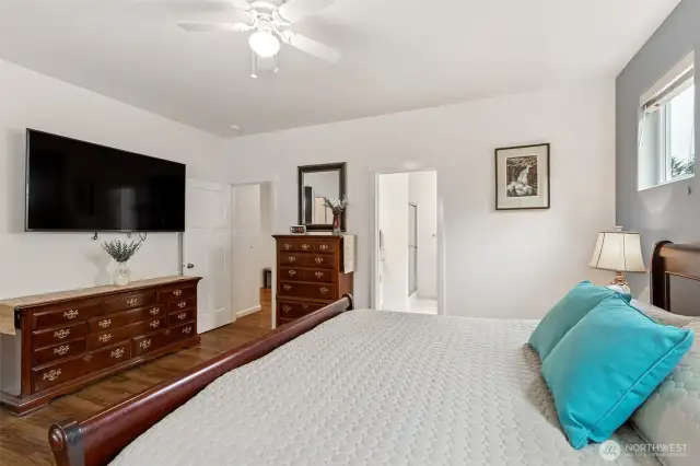High ceilings and great natural light compliment this primary bedroom suite