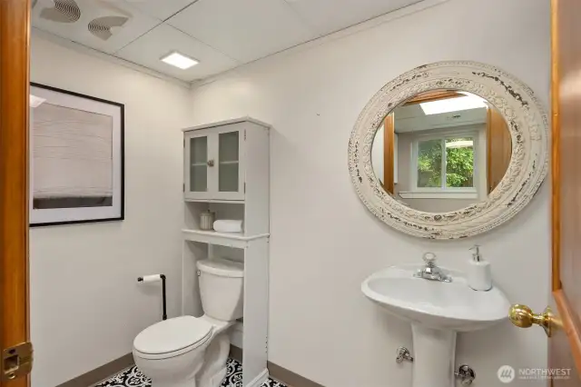 In the laundry area off the garage features a powder room