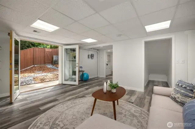 French doors in the basement lead out to a private side yard
