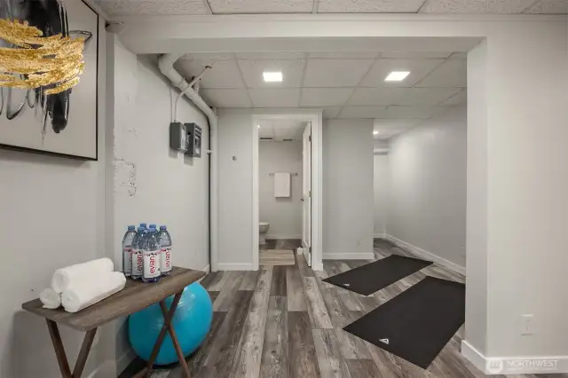 More finished basement space looking into the full bathroom