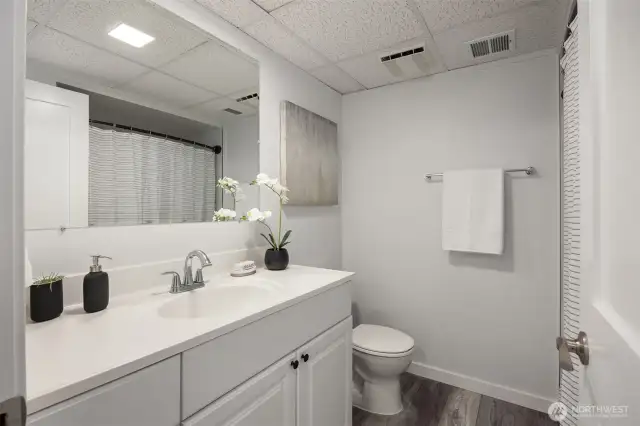 A fully finished basement bathroom with a shower/tub combo