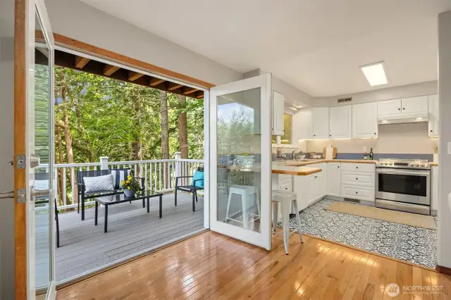 Large french doors right off the kitchen/dining area.
