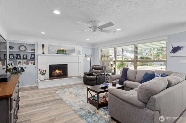 Wide picture windows with front yard views