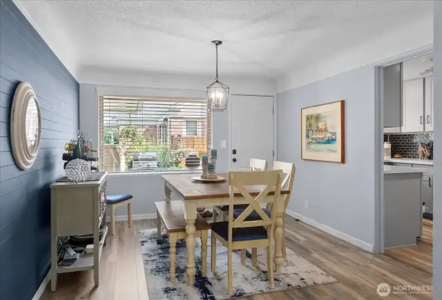 Stylish light fixture adds a modern touch * Charming shiplap accent wall