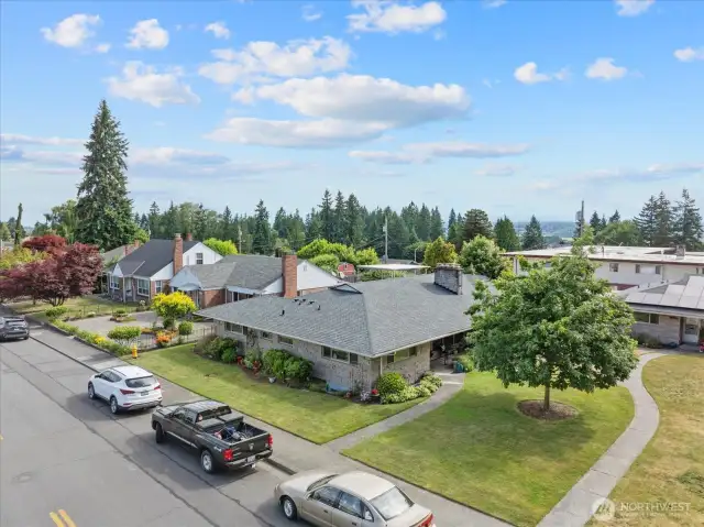 Spacious corner lot with mature landscaping