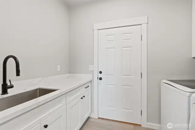Laundry room with storage, counters and sinks. Washer and dryer included!