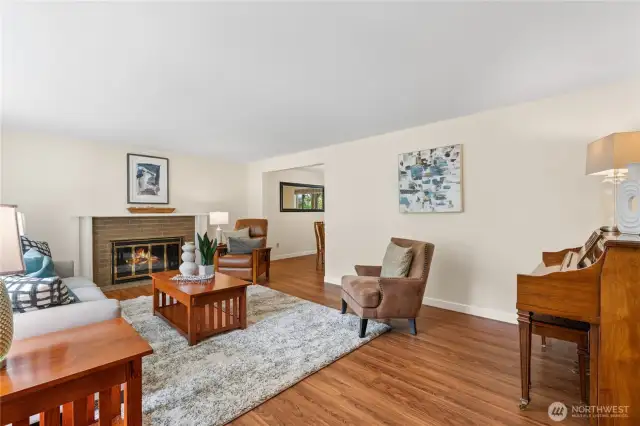 Looking to the left from the front door is the living room. Entertain guests, enjoy the light throught the bay windows, or keep cozy by the wood fireplace.