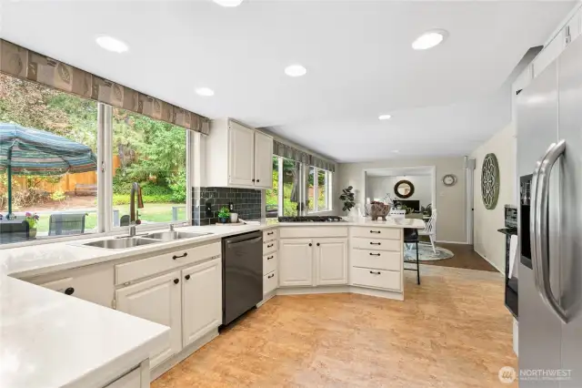 Kitchen adjoins secondary dining area, as well as the family room through french doors.