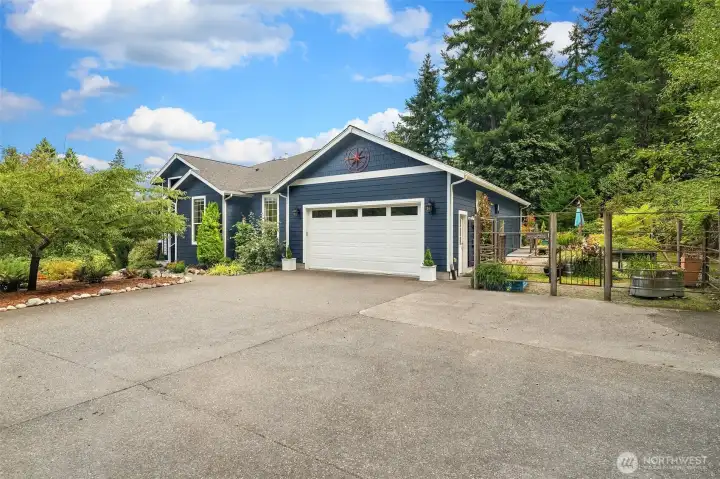 Large garage with an amazing workout/studio room.