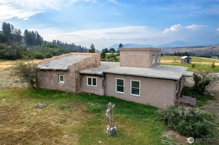 Stick frame and post and beam construction with stucco exterior and plaster interior walls.