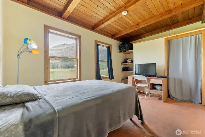 Exposed beam ceilings throughout home.