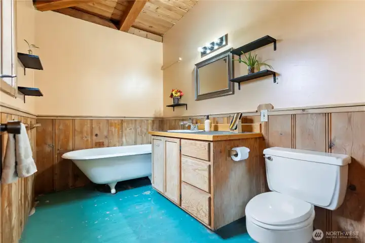 Second bathroom with claw foot soaking tub to service guests or the bedroom on this wing of the home.