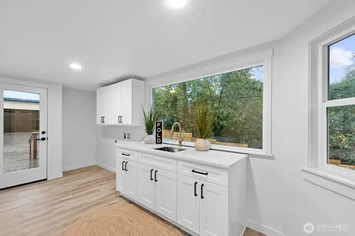 Huge laundry / mud room that flows out to the deck.