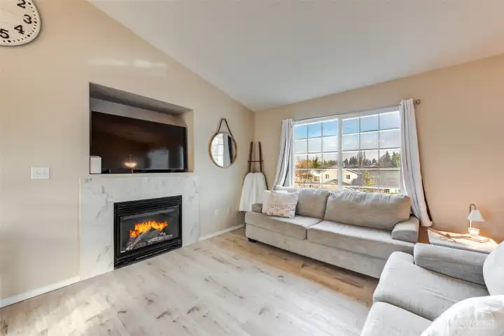 Vaulted ceilings create an open, airy feel in the living room