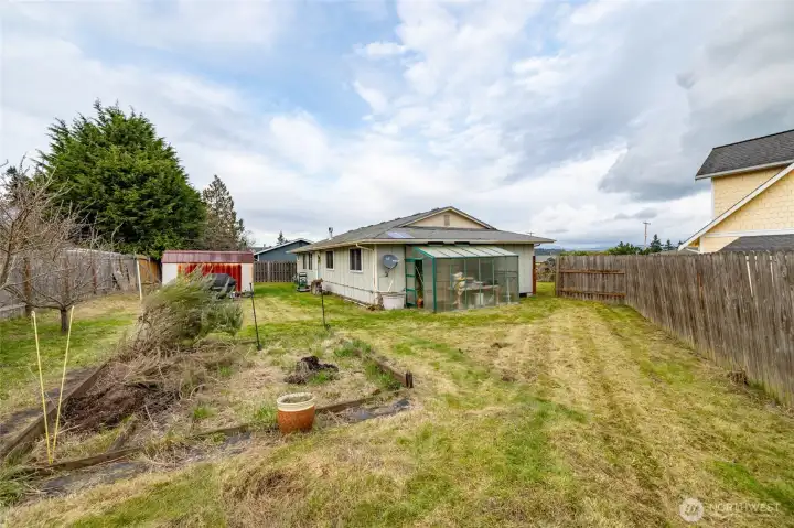 Large back yard with full sun and garden space...