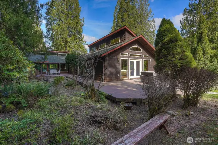 Surrounded by mature trees and natural landscaping, it offers a private and peaceful retreat.
