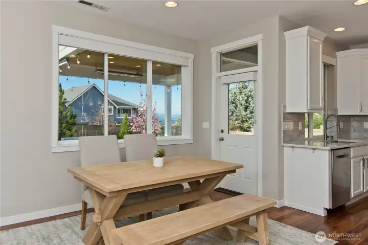 Dining area has patio door to private, fully fenced back yard.