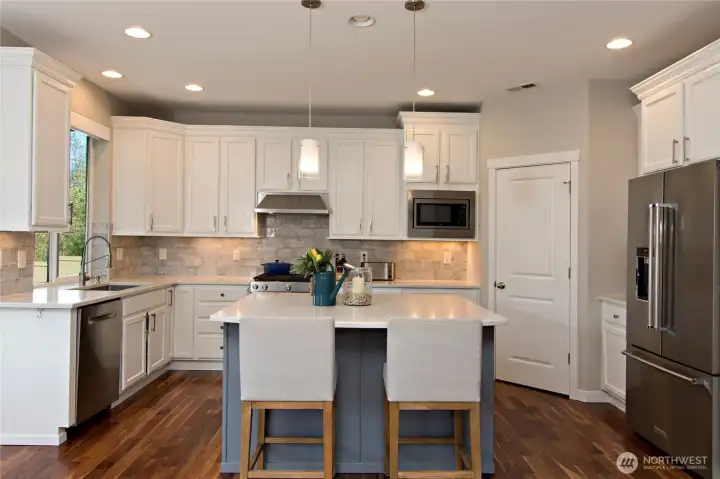 Lots of natural and canned lighting in the kitchen!