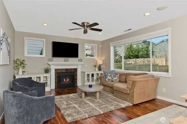 Gas fireplace and remote-control shades from The Shade Store. Built-in custom speakers.