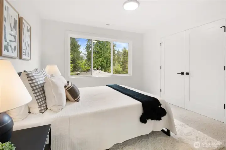 Upstairs bedroom with built in closet shelving